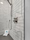 Stay dry and set the water temperature in Bathroom 1