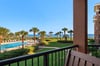 Soak in sweeping views of the sparkling pool, manicured lawns, swaying palms, and the shimmering ocean beyond from the comfort of your private balcony.