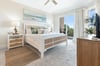 Your serene coastal retreat awaits with a plush bed, soothing oceaninspired decor, and private balcony access where you can unwind with natural light and refreshing breezes.