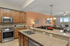 Picture yourself preparing meals on granite counters in the fullyequipped kitchen, then relaxing in the open living area with windows framing lush views.