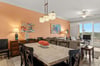 Spacious openconcept living and dining area, create a welcoming atmosphere. Natural light pours in, inviting you to unwind or gather for meals together.