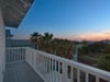 Balcony View of Coastal Sunsets