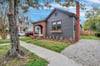 This charming bungalow stands out amongst the rest, featuring beautiful flower boxes and curb appeal.