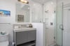 The ensuite bathroom offers a large vanity, walkin shower and also connects to the hallway.