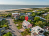 Steps to beach access, this beach side home stands amongst the rest