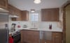 An identical kitchen with highend appliances are offered.