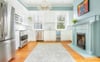 stainless steel appliances and marble countertops.