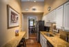 This galley kitchen has a breakfast bar