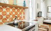 Hand painted ceramic tiles make for the perfect backsplash.