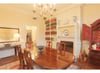 Elegant dining room with original fire place.