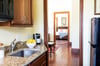 View of the quaint kitchen looking through the apartment.