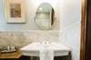 The pedestal sink offers a bit of Savannah charm