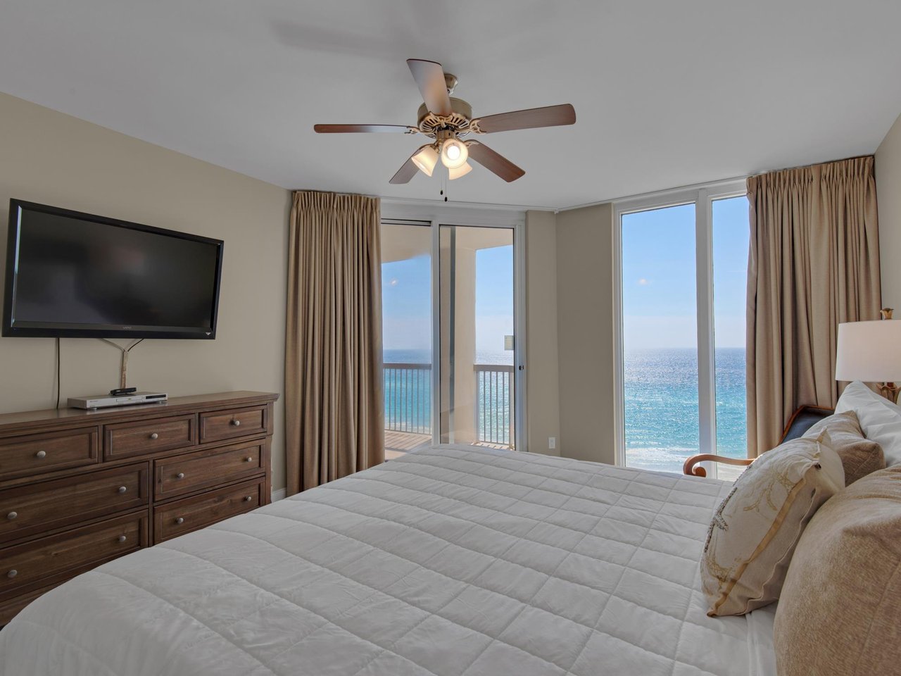 1953492 Master Bedroom With Flat Screen Tv And Access To Private Balcony