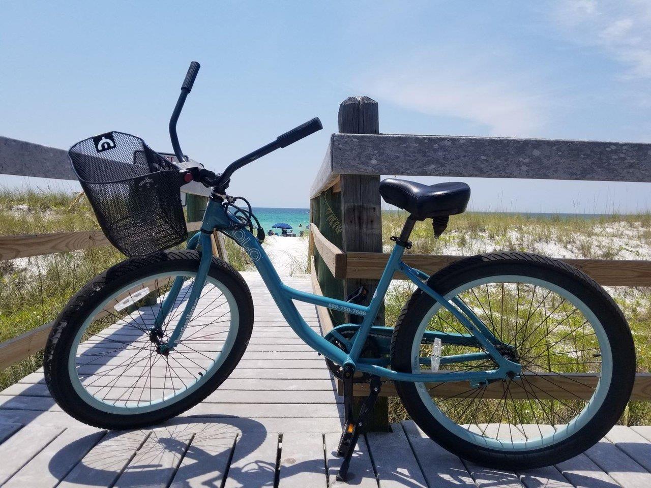 a bicycle parked on a wooden bench