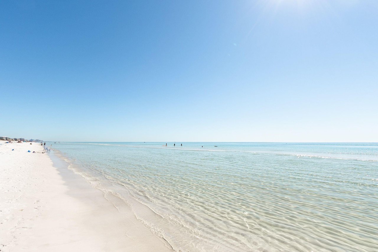 2129210 A Beach With A Body Of Water