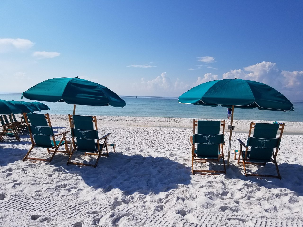2129777 Chairs And Umbrellas On A Beach