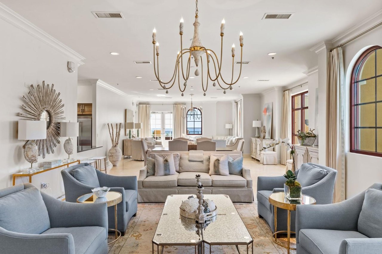 2189100 A Living Room With A Chandelier And A Couch