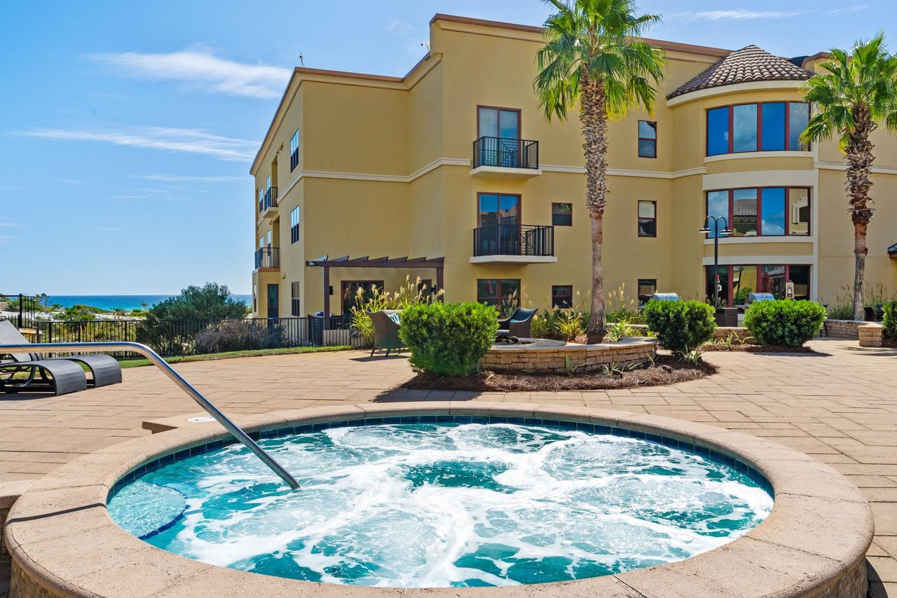 2191160 A Large Building With A Pool In Front Of It