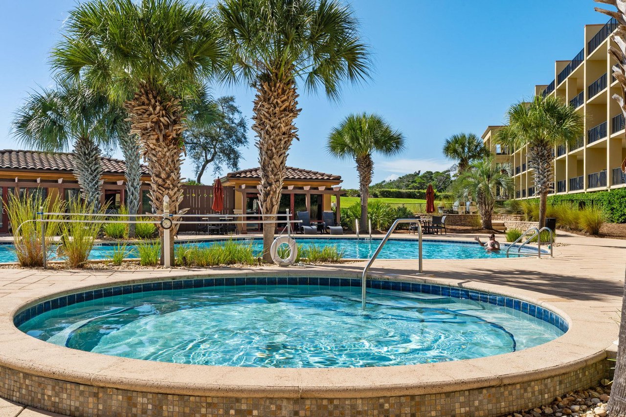2191162 A Pool With Trees And Buildings Around It