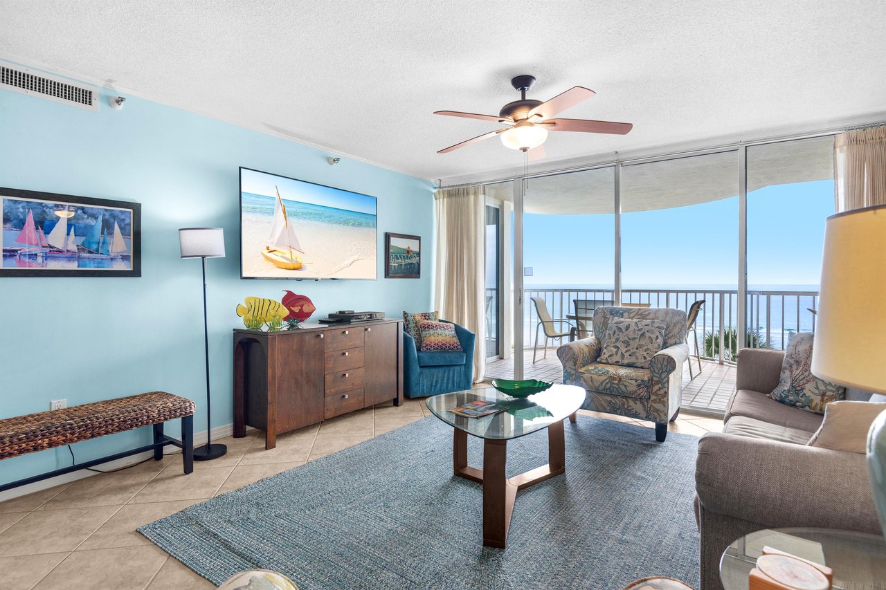 Relax in your coastal living room with stunning ocean views, comfortable seating, and a private balcony where ocean breezes await.