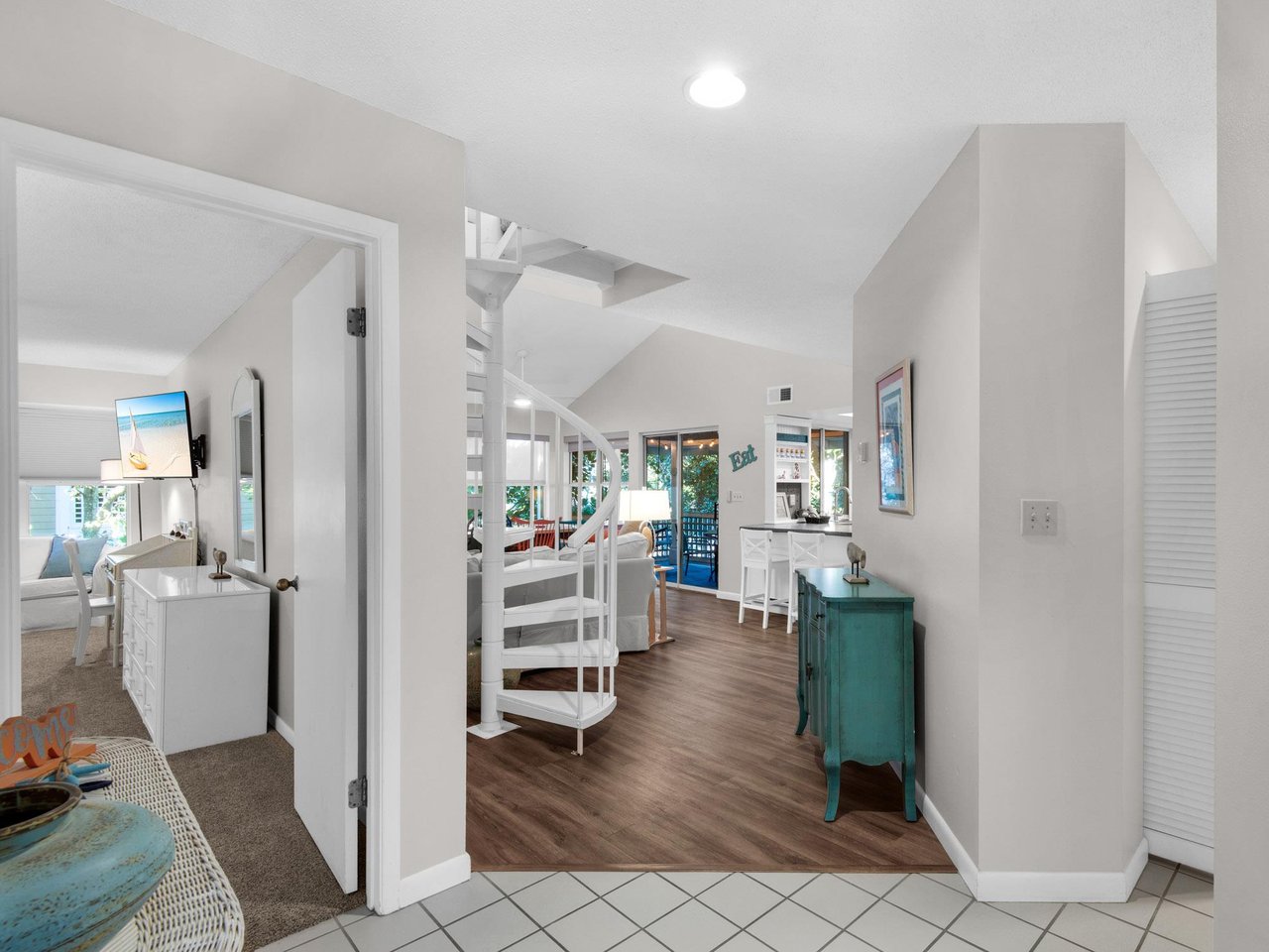 Step into your bright, openconcept retreat where coastal charm meets modern comfort through airy spaces and cheerful turquoise accents.