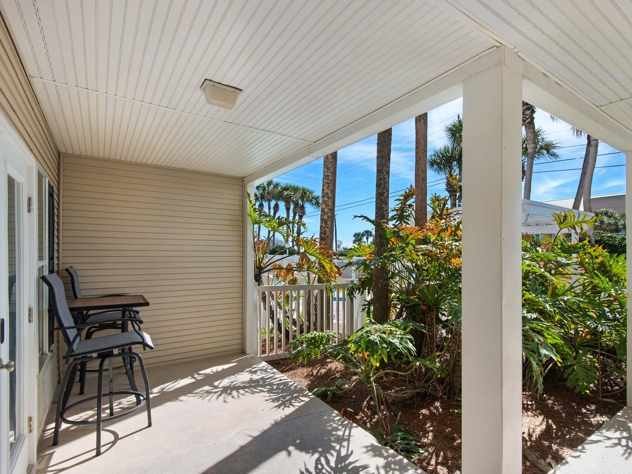 Relax on the private covered patio with comfortable seating for morning coffee or evening unwind.