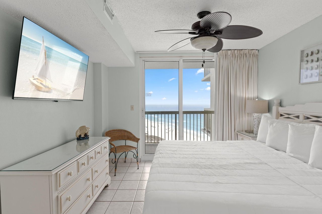 Bedroom 1 features direct access to the private balcony