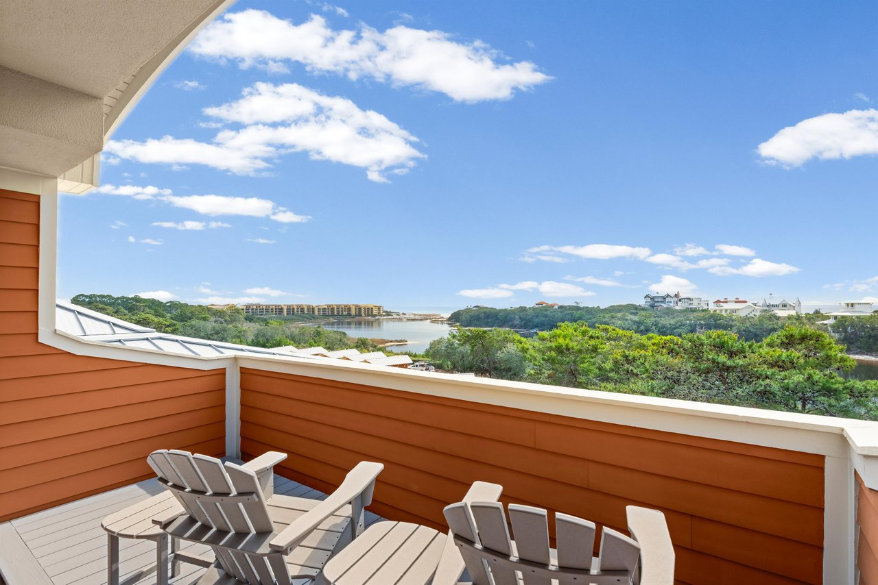 Relax on the second floor private balcony chairs while soaking up sweeping gulf and lake views under endless blue skies.