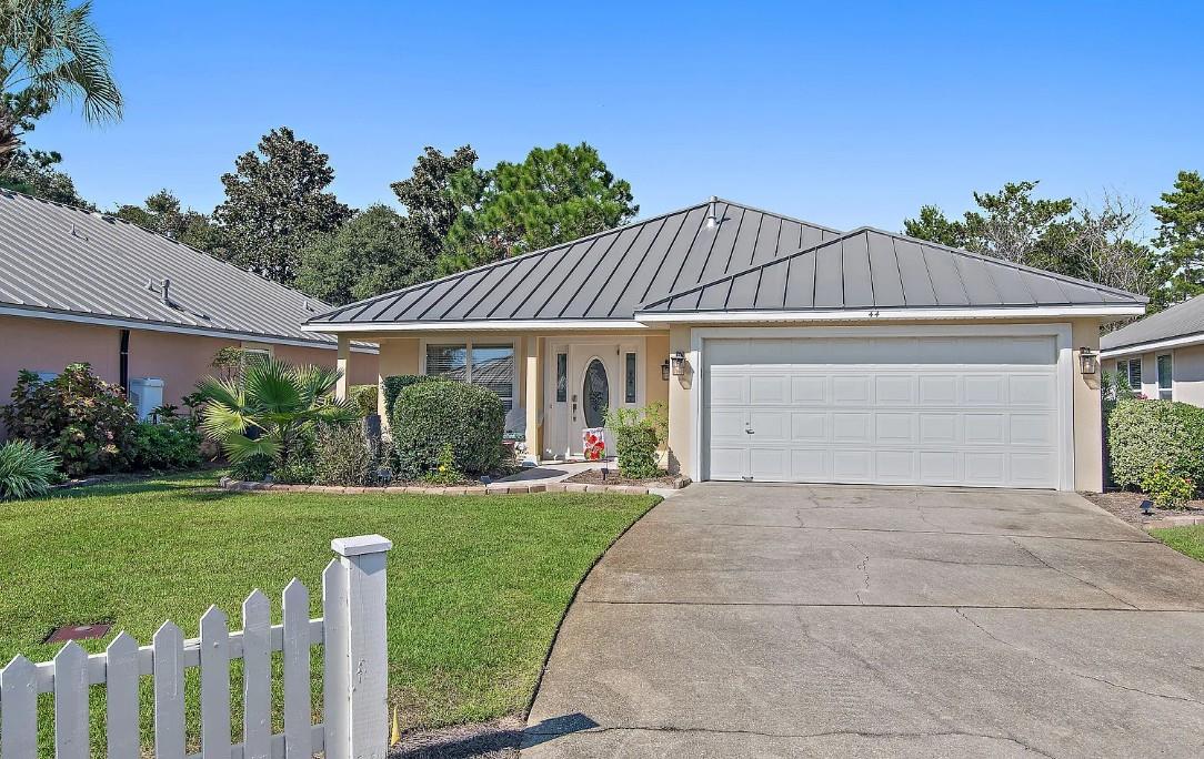 Charming singlestory home with convenient parking in a peaceful gated neighborhood.