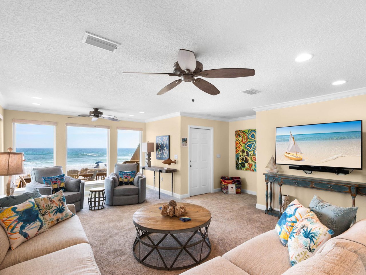 Relax in your bright beachfront living room with sweeping ocean views and coastalthemed comfort.