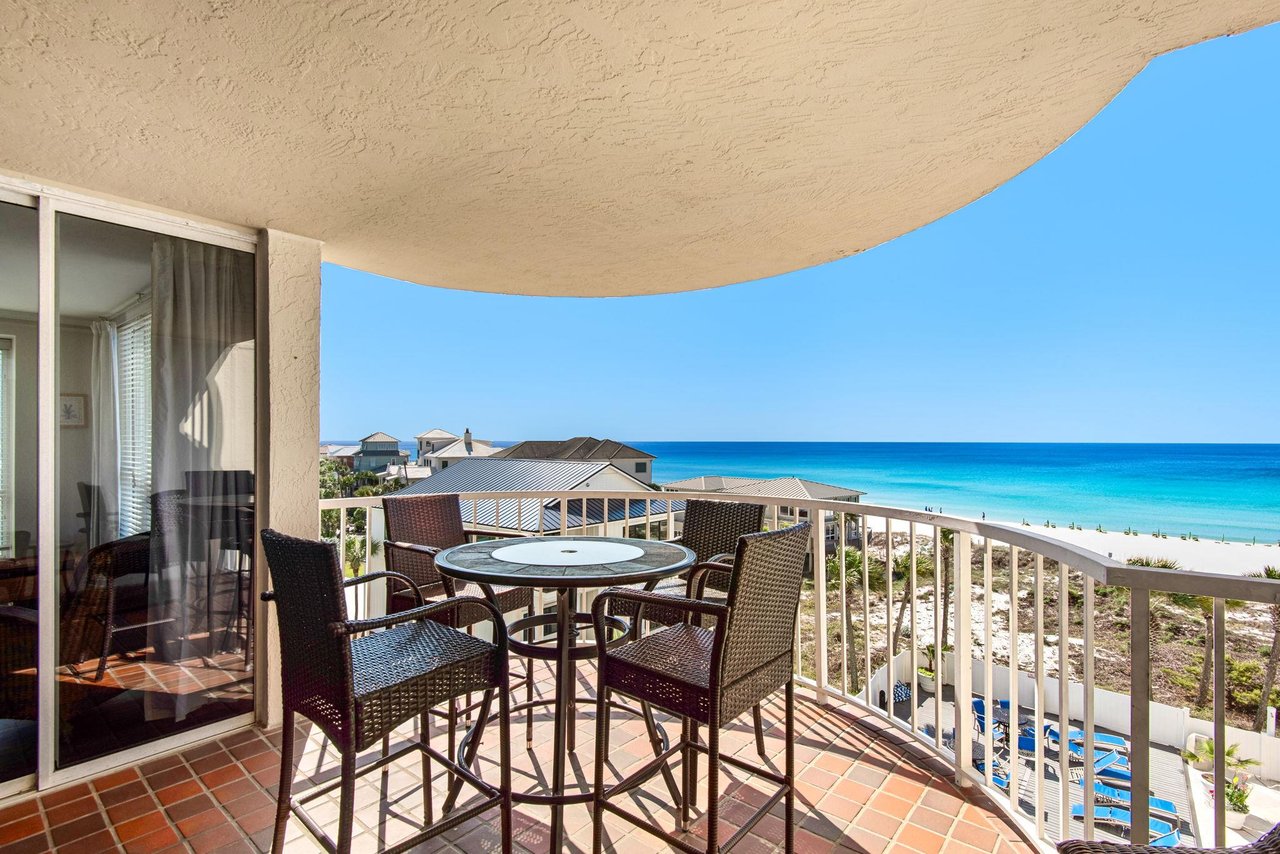 Sip your morning coffee at your private table while watching the turquoise waves roll onto pristine white sand.