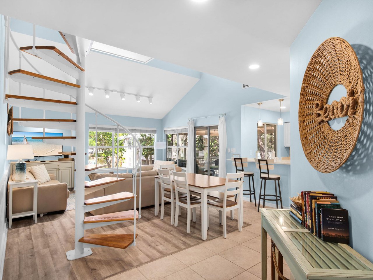 Relax in this bright, airy space where coastal blues meet warm wood tones.