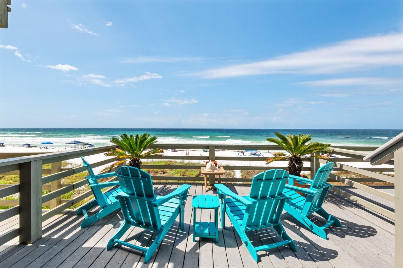 Relax in turquoise beach chairs on the private decks with stunning Gulf views