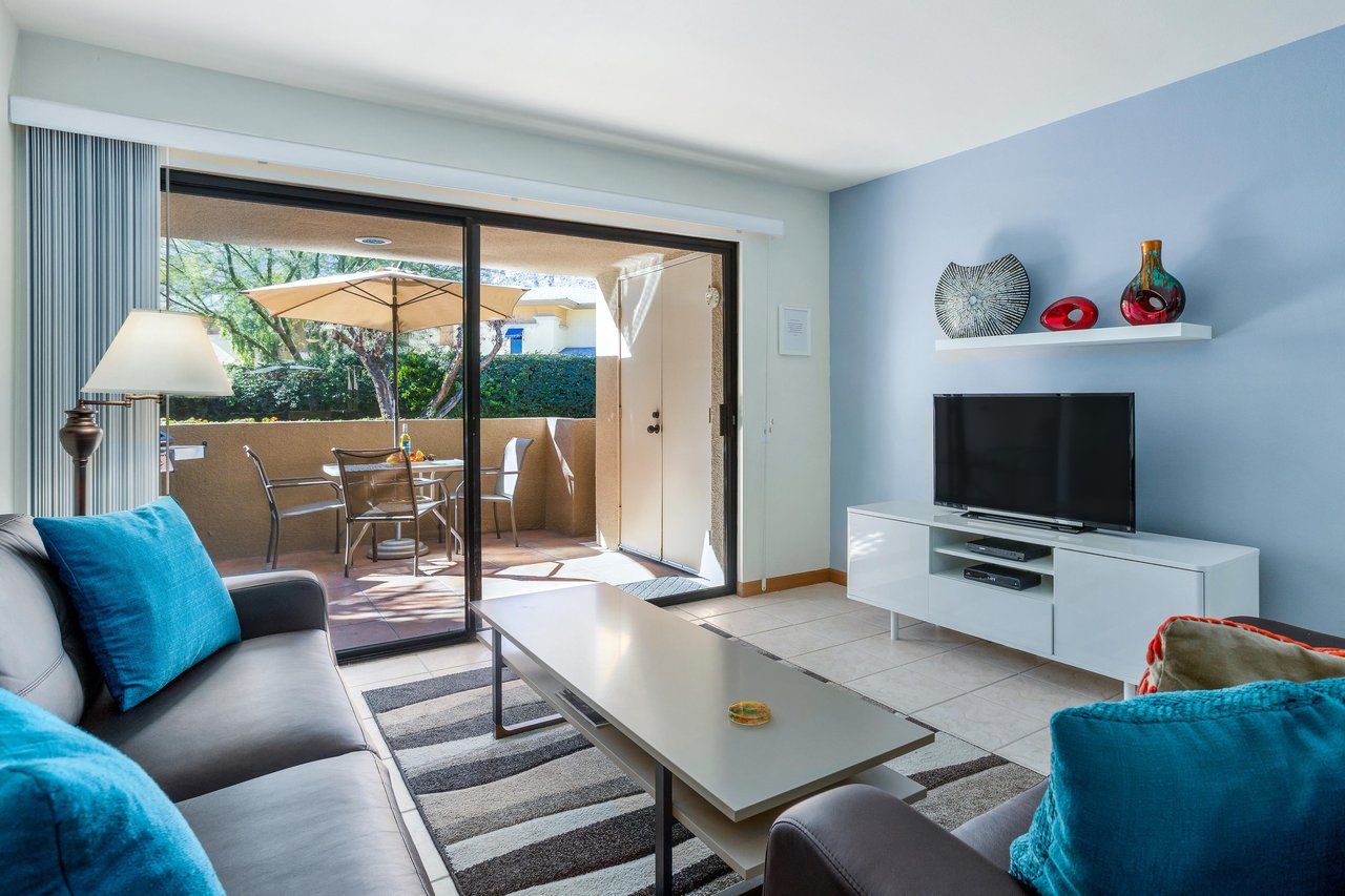 Wall of glass in the living room lets the sunlight shine in