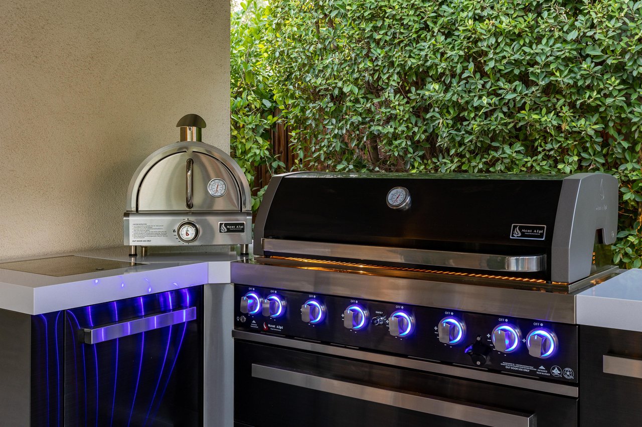 Pizza oven next to the grill