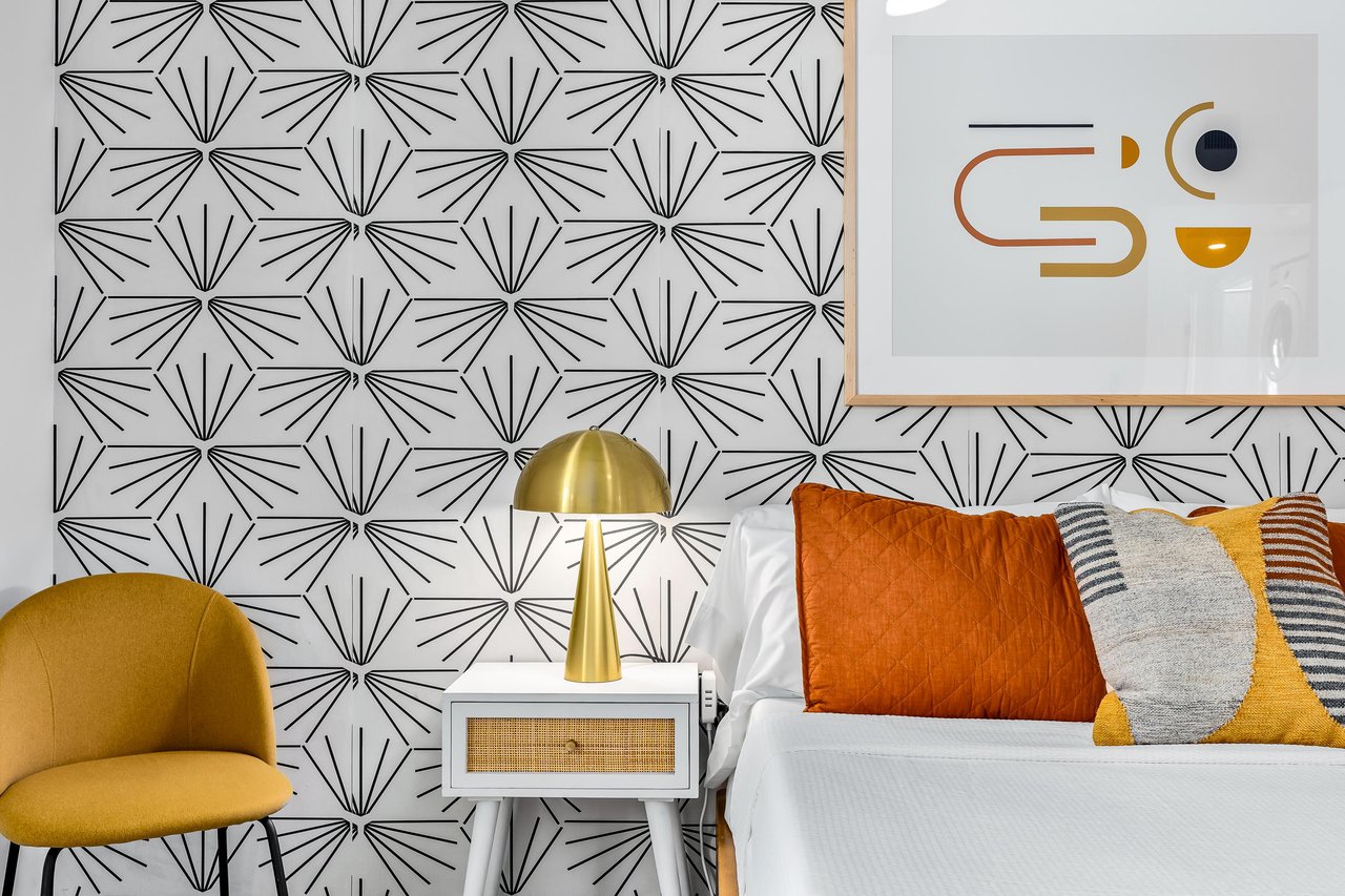 Gold accents adorn this guest bedroom