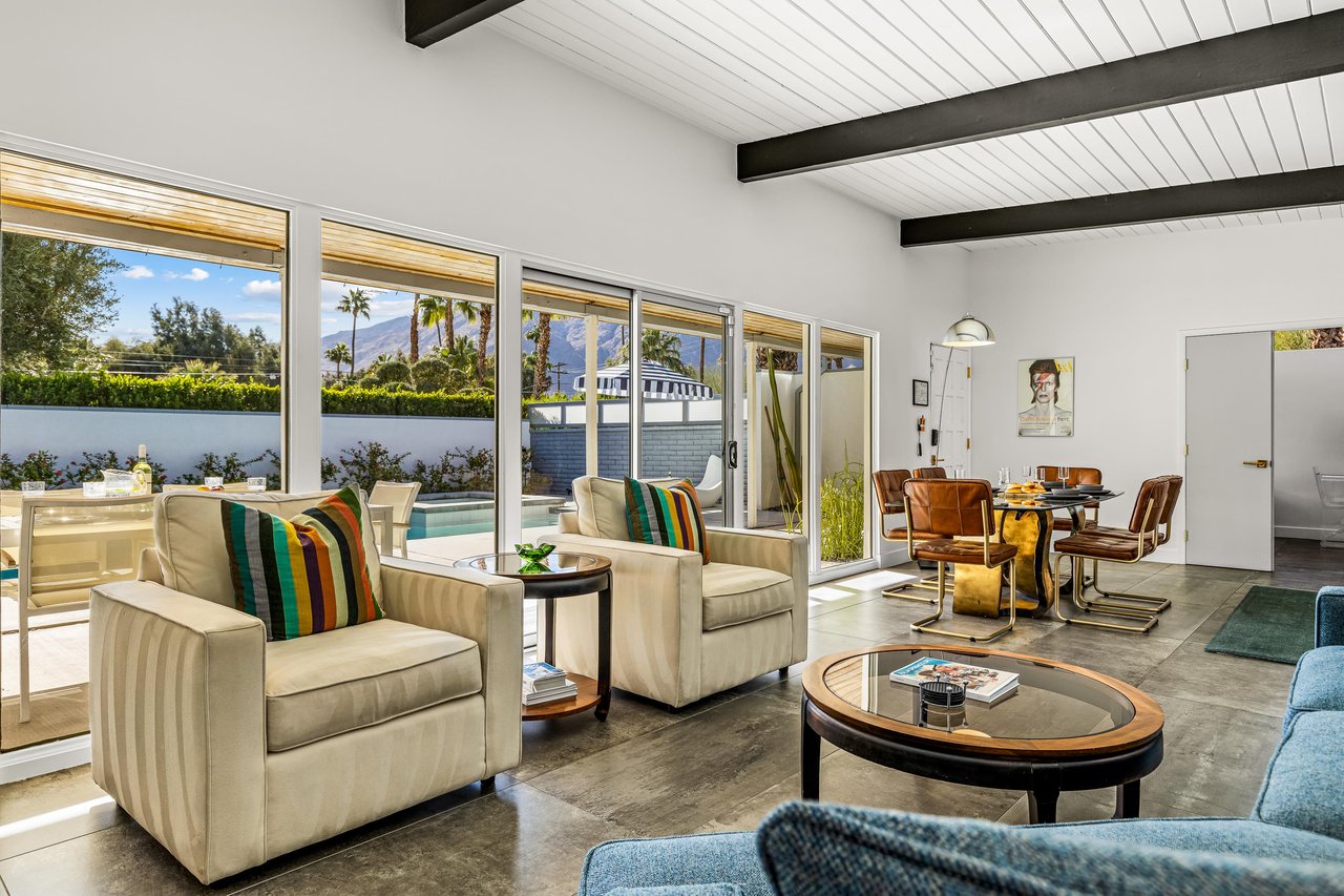 Wall to ceiling open windows let the light in