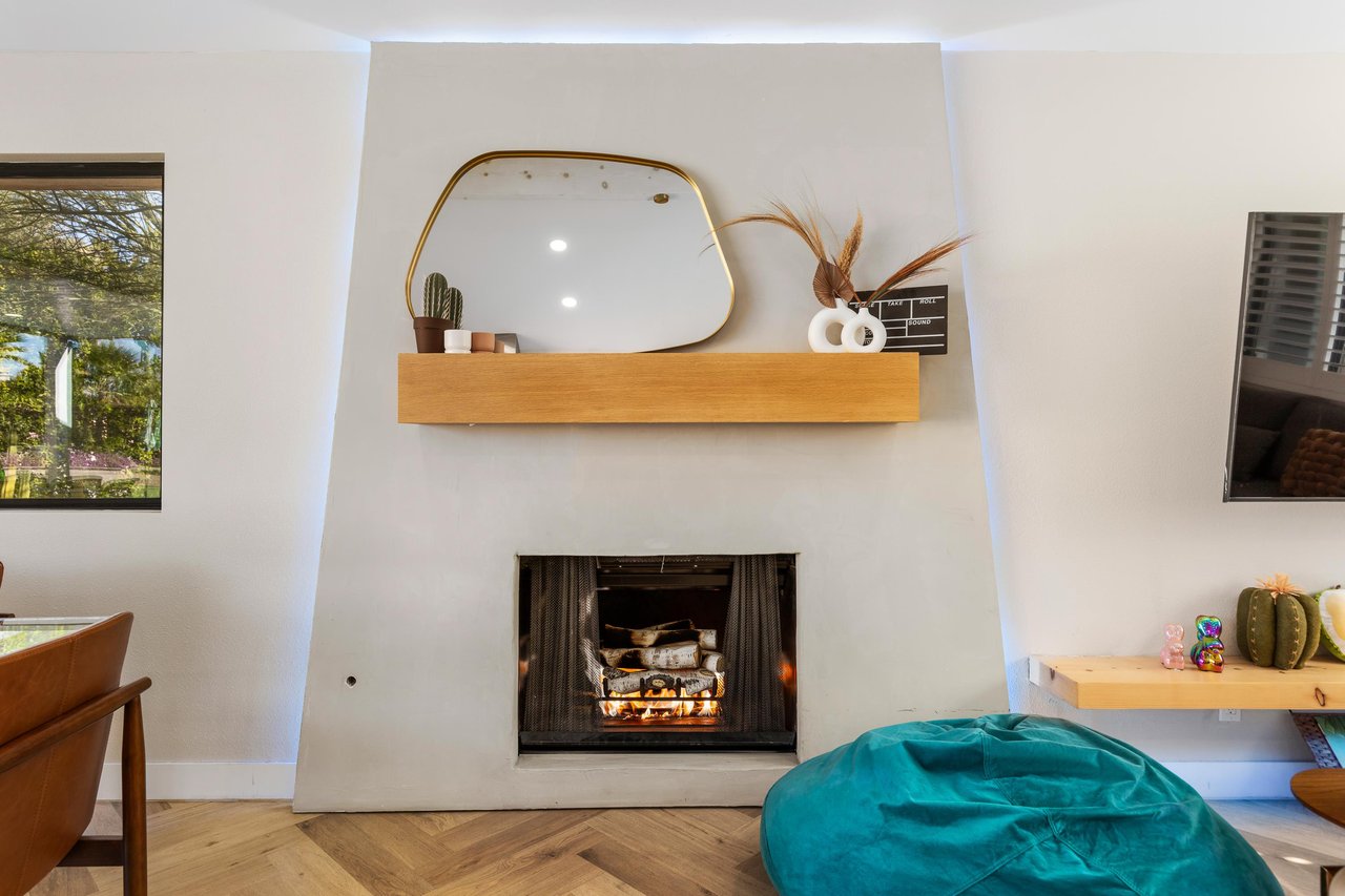 Gather around the fireplace with a glass of wine