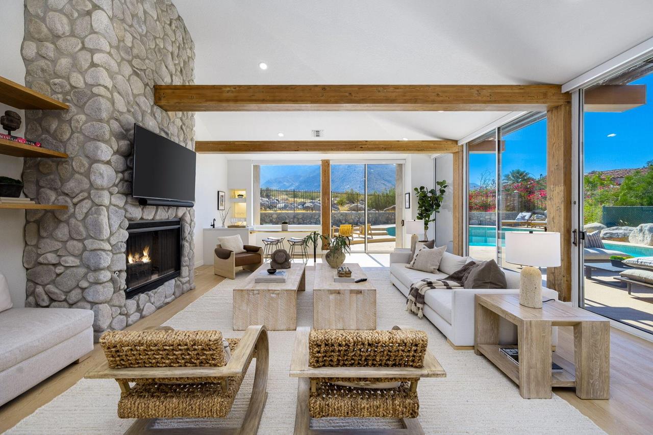 Openconcept space with seamless kitchen, dining, and living areas, filled with natural light.