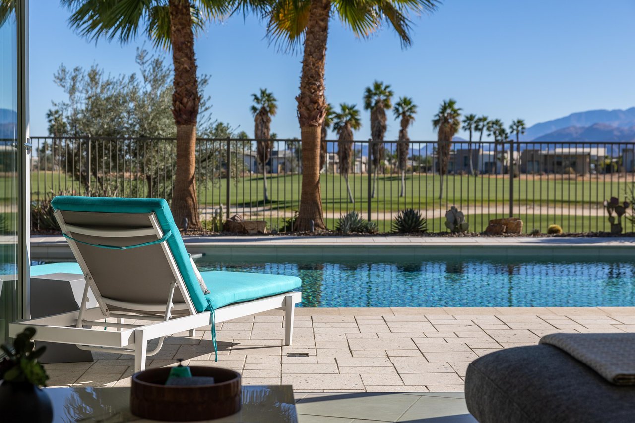 The house is surrounded by Palm Trees