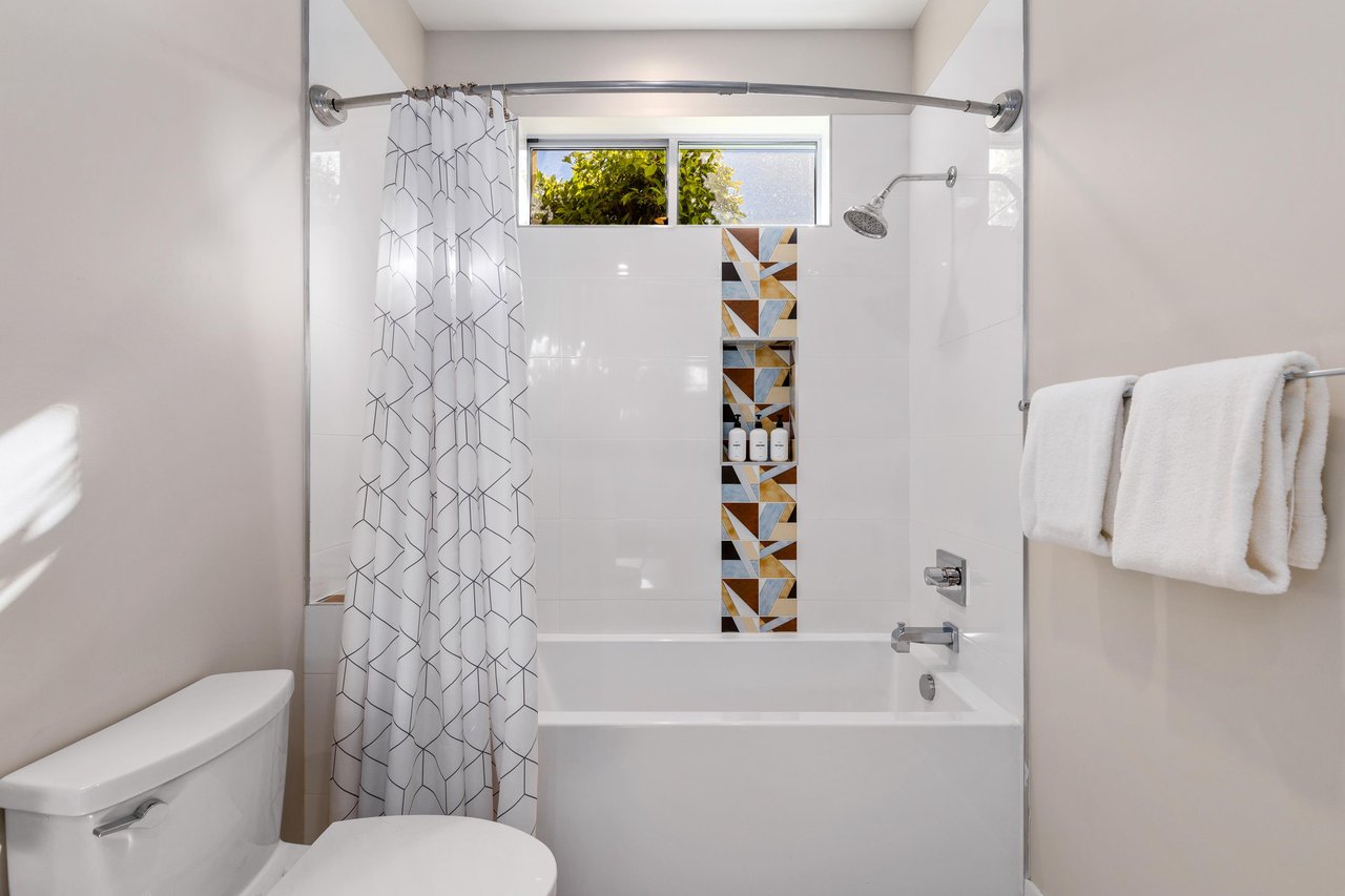Guest bathroom with bathtub