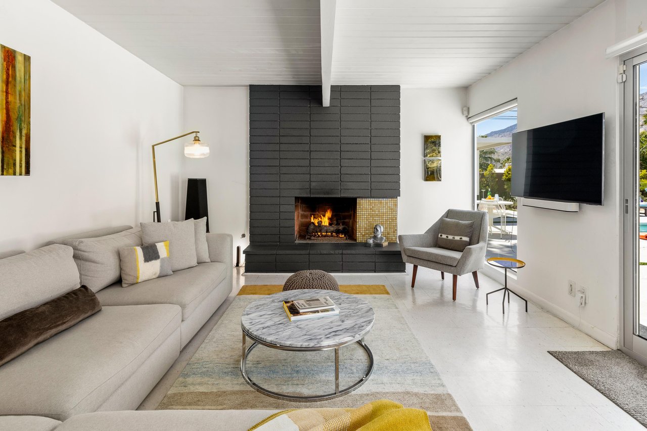 Free flowing living room with gorgeous fireplace