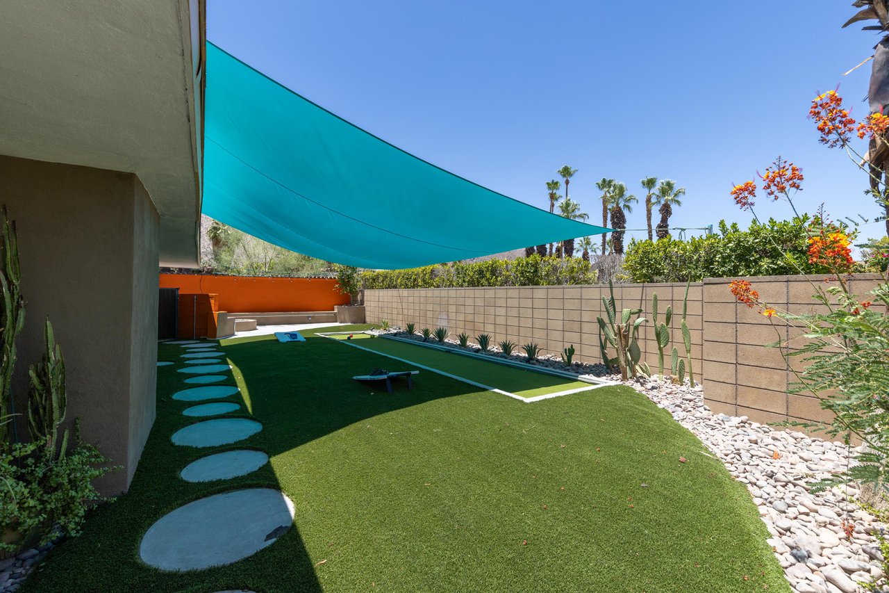 Side yard with bocce ball court