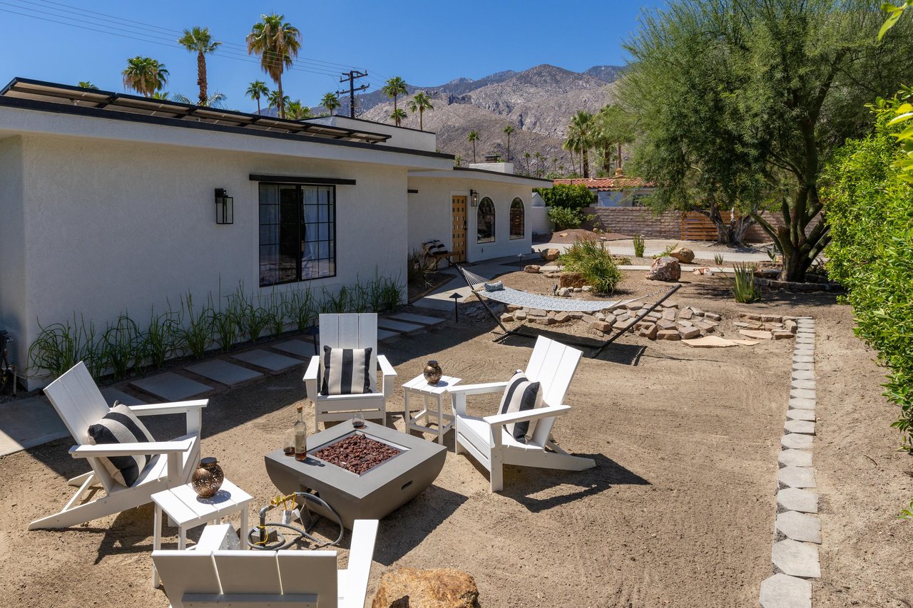 Side yard with firepit and hammock