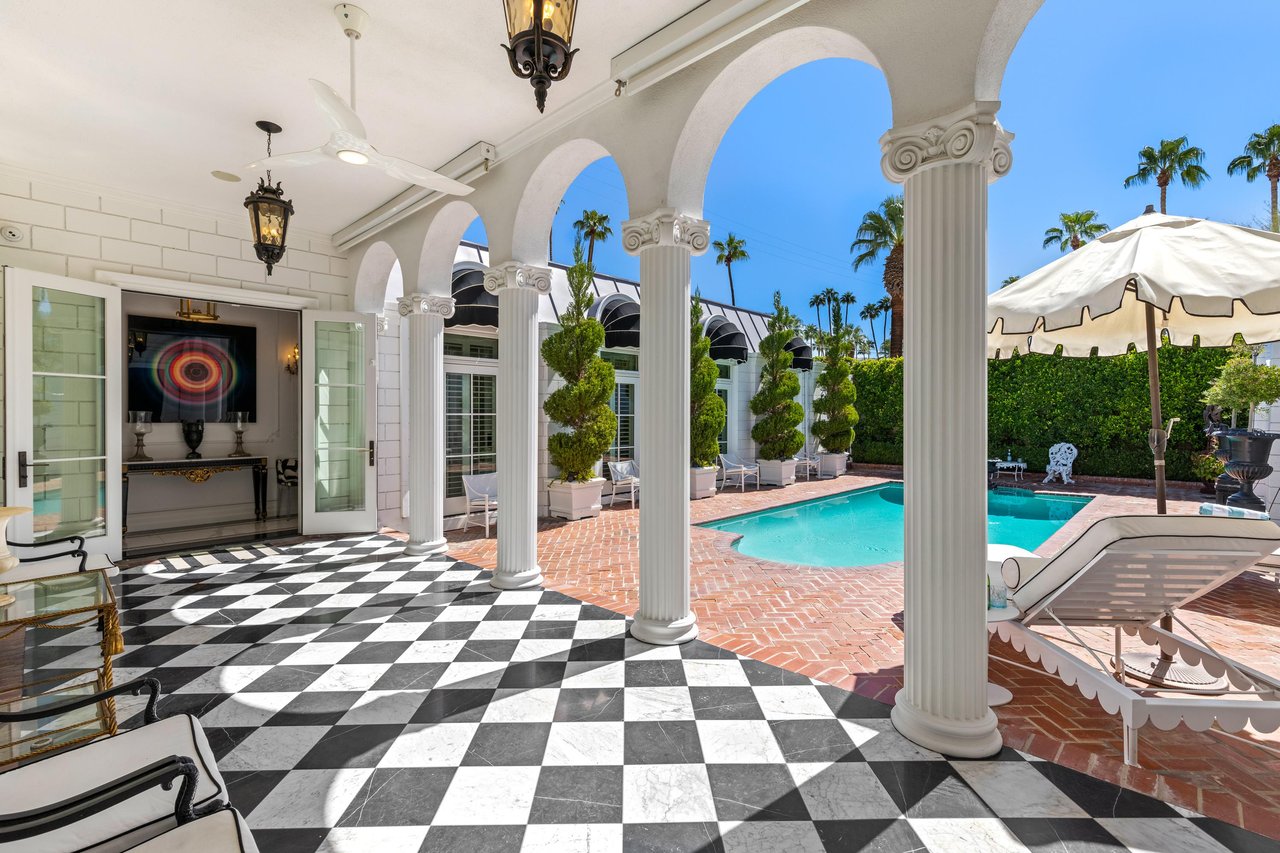 Black  white marble floors lead to the Pool