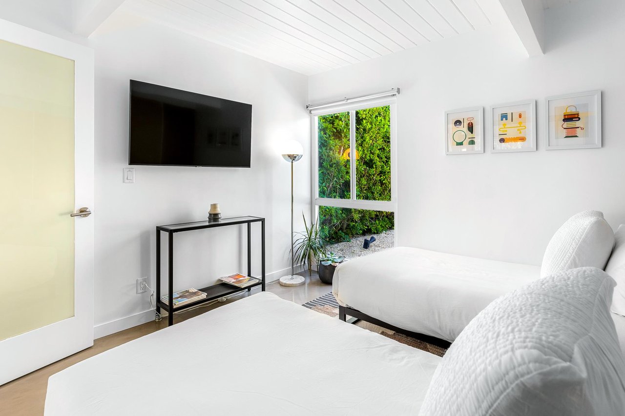 Guest bedroom with access to the yard