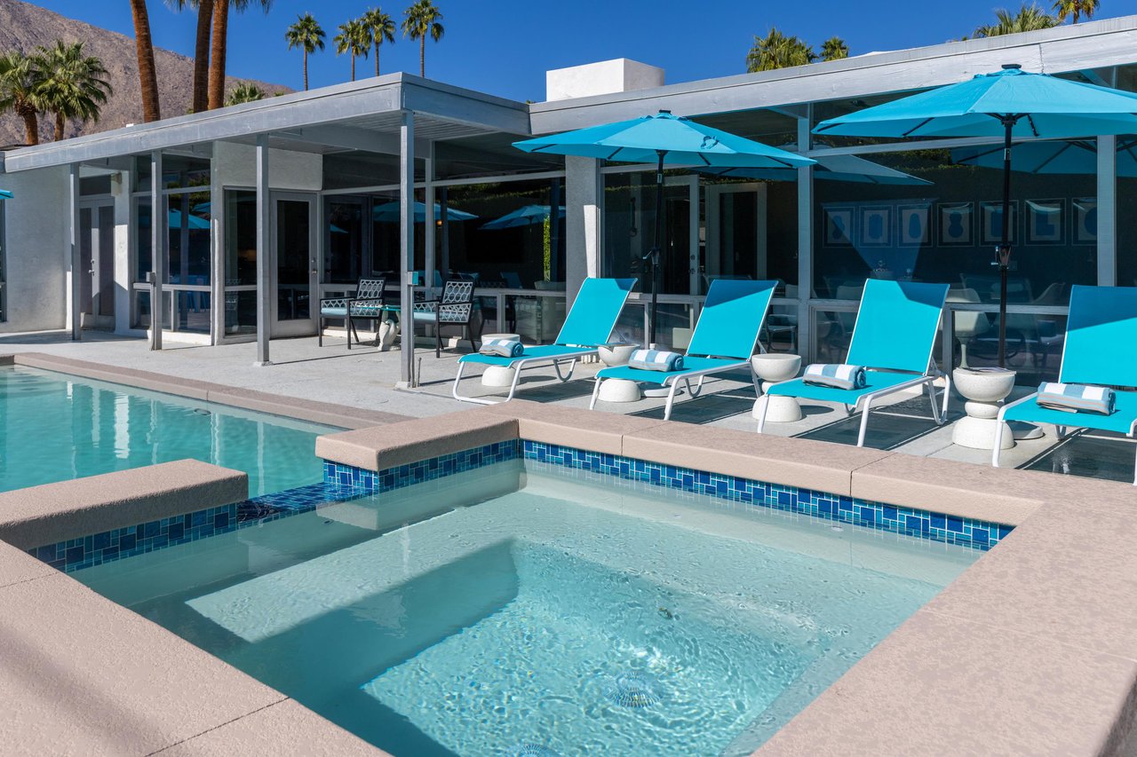 Attached waterfall edge spa