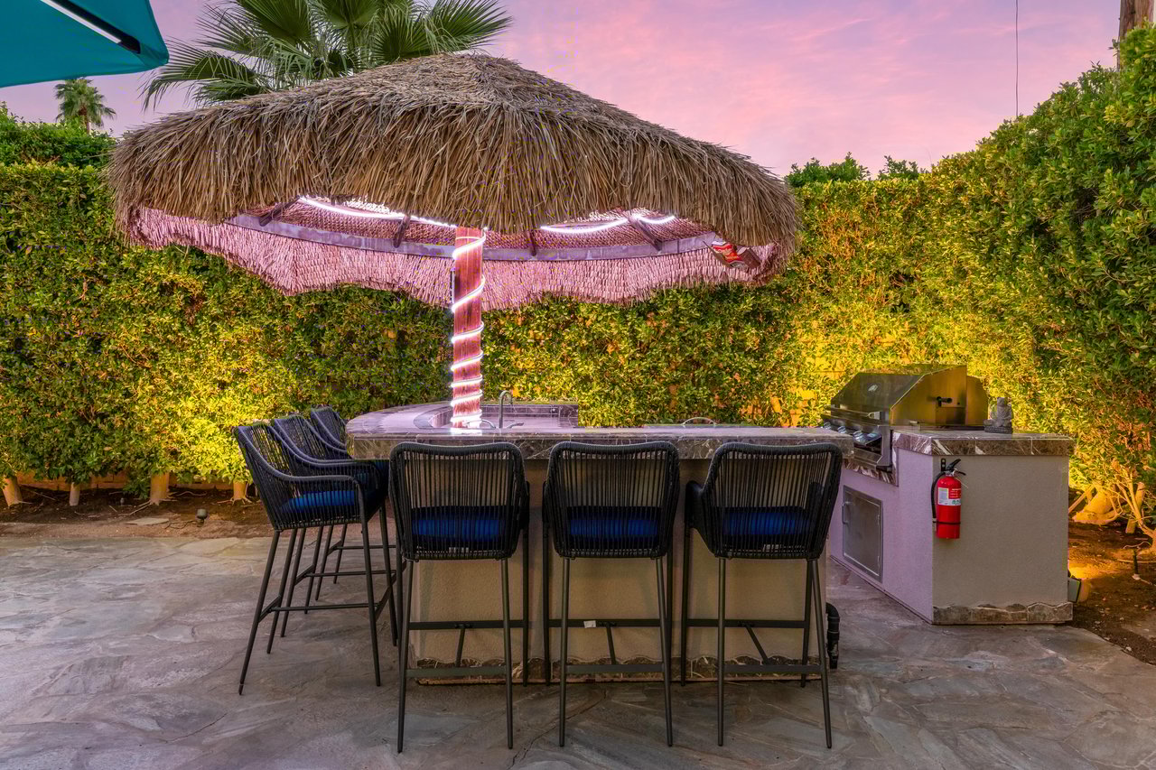 Belly up to the Outdoor Palapa kitchen for a drink