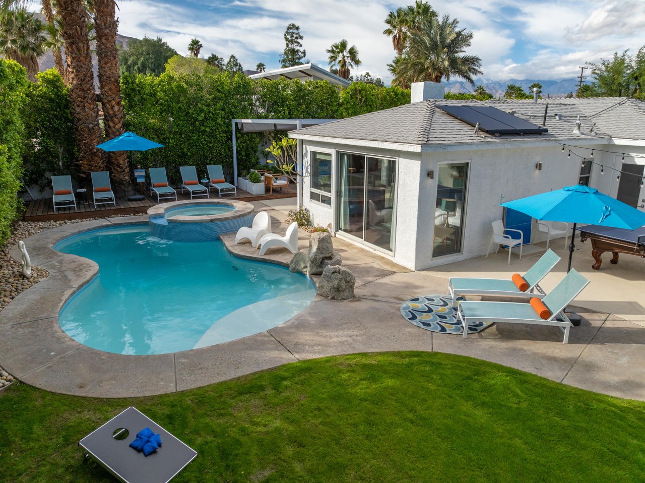 Figure eight pool with attached waterfall edge spa