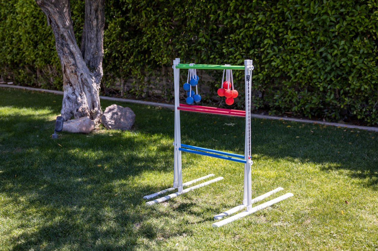 Play ladder toss on the green yard,
